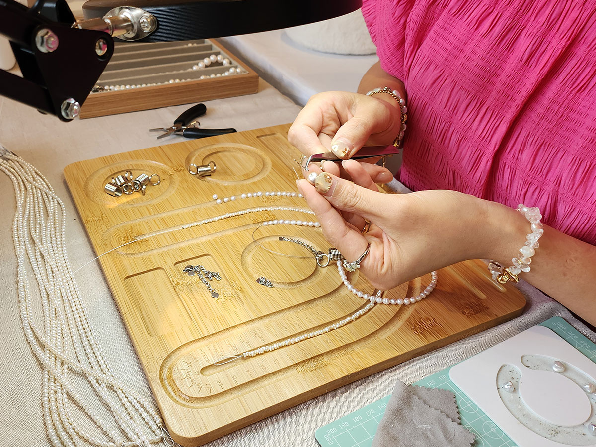 Lisa Yuyi of Mermade Pearl Studio working in her Christchurch Ōtautahi studio