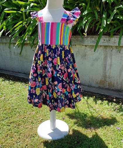 Bright summer dress with floral flutters and skirt, and striped elastized bodice. Size/Age 4 (Also available on order Sizes 2, 6 & 8