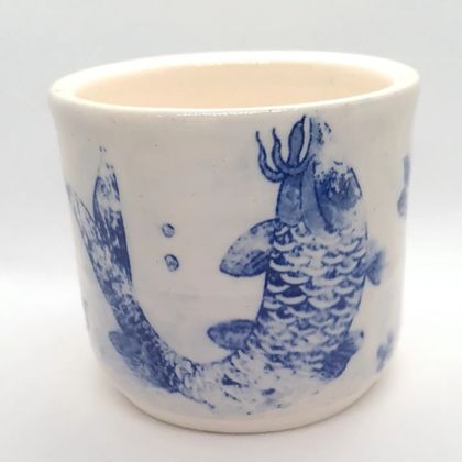 White pottery vessel distressed koi
