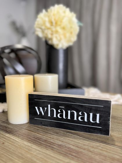Wooden "Whānau" sign