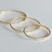 Three gold rings- 9ct yellow or rose