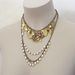 Rococo: statement necklace with charms and vintage pearls, in gold, brass, purple and copper