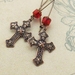 In The Scarlet Cathedral earrings: antiqued copper-plated crosses with brilliant red glass on long ear-wires