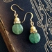 Aida earrings: green gemstone, rhinestones, and gold 