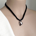 Longing Heart necklace: Swarovski crystal pendant in moody grey on black satin cords