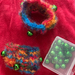 Rainbow cuffs with bells on. 