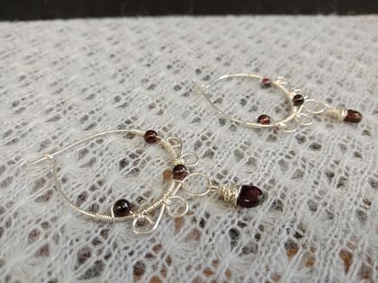 Sterling silver wrapped hoop earring with garnet beads