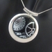 Silver "Timepieces" dichroic glass necklace - round silver plated setting